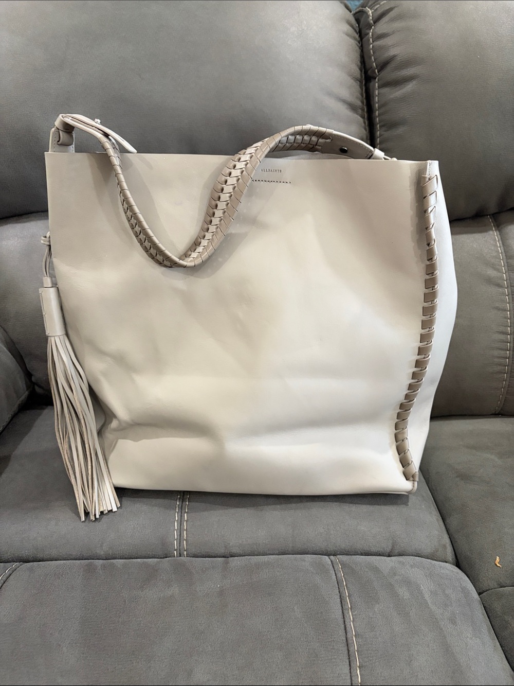 AllSaints Elegant Light Grey Tote Bag with Braided Handle and Tassel